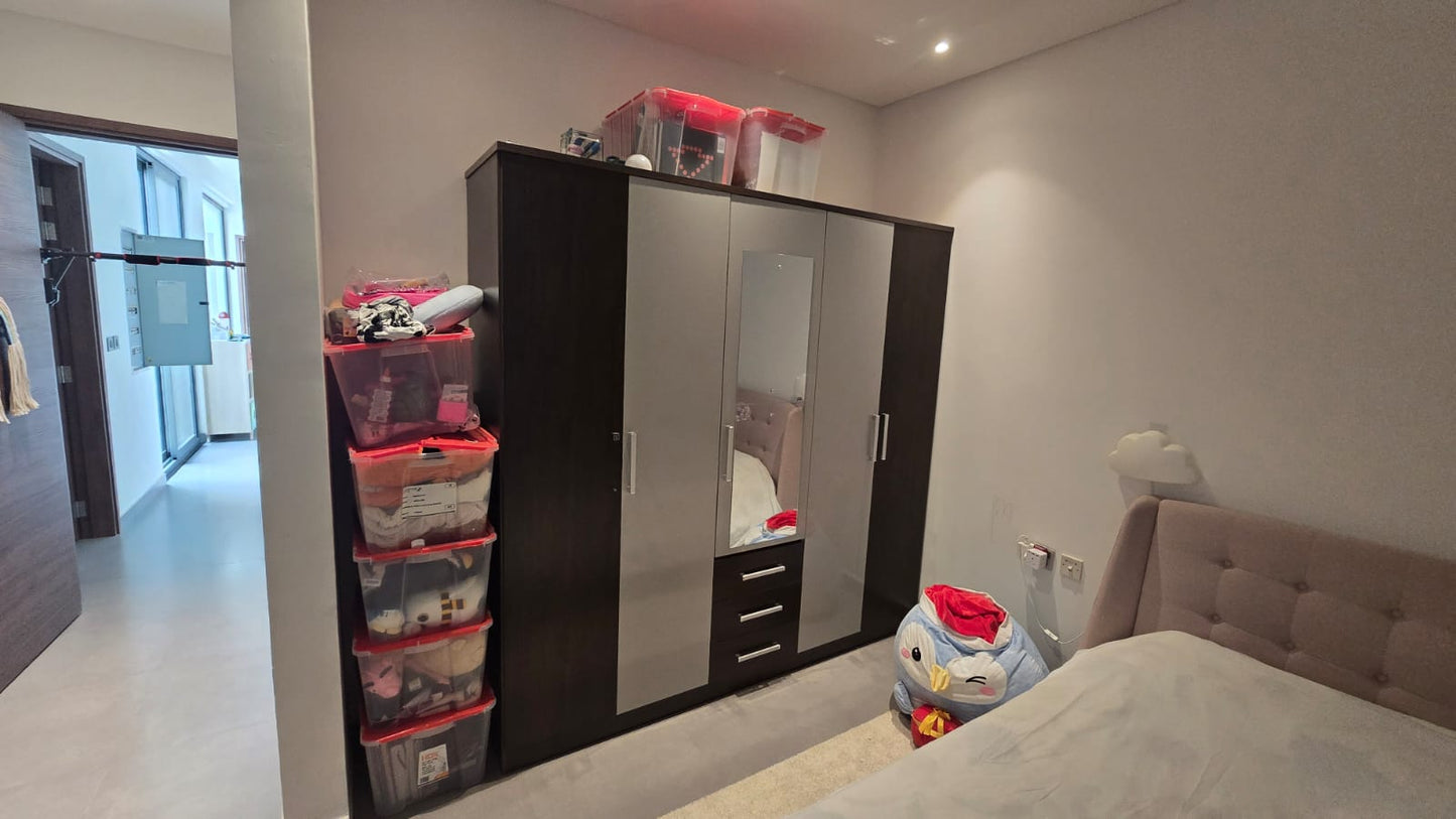 4-door dark espresso wardrobe with mirrored doors and built-in drawers