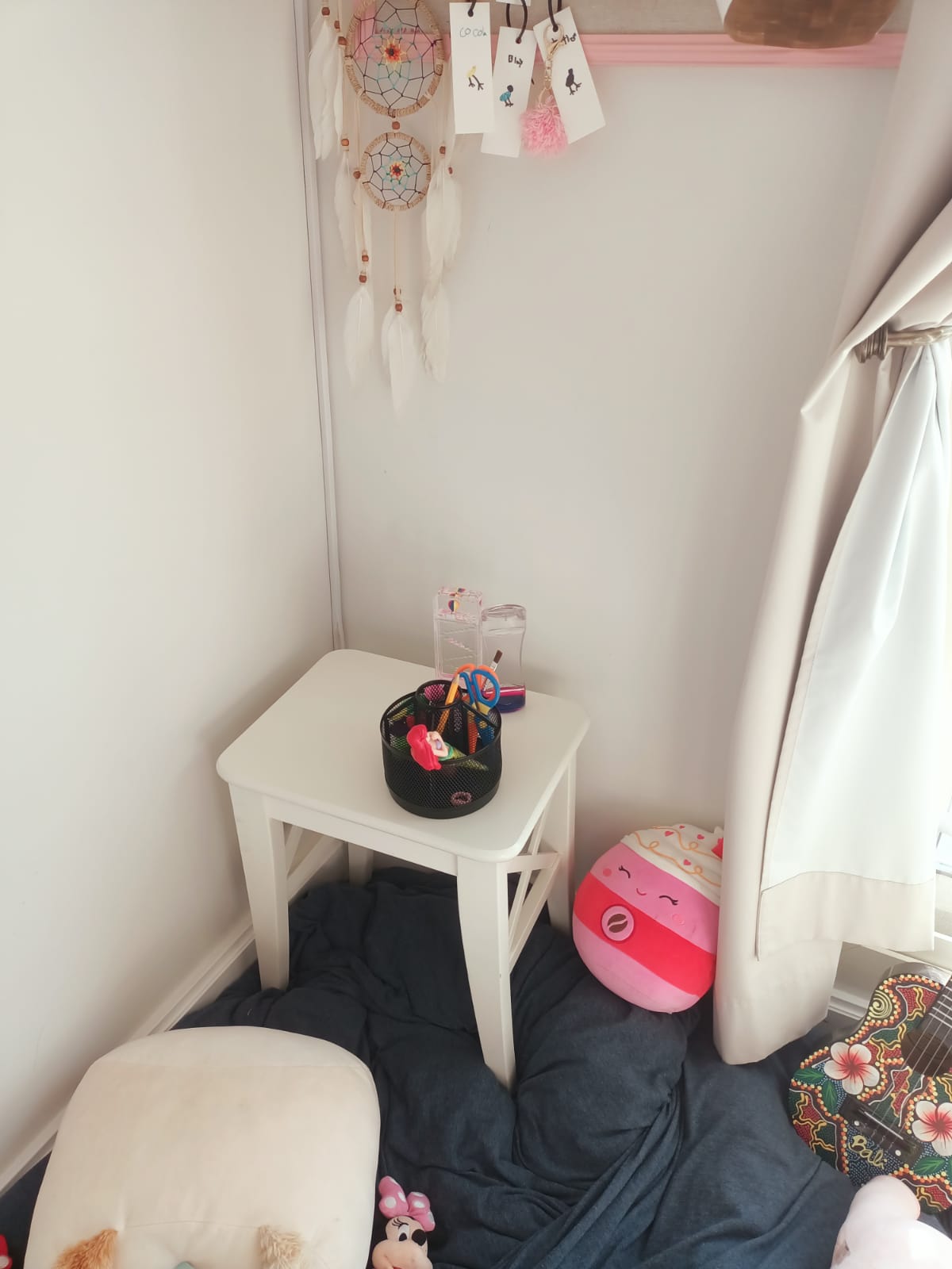 Original photo of white side table in corner of room