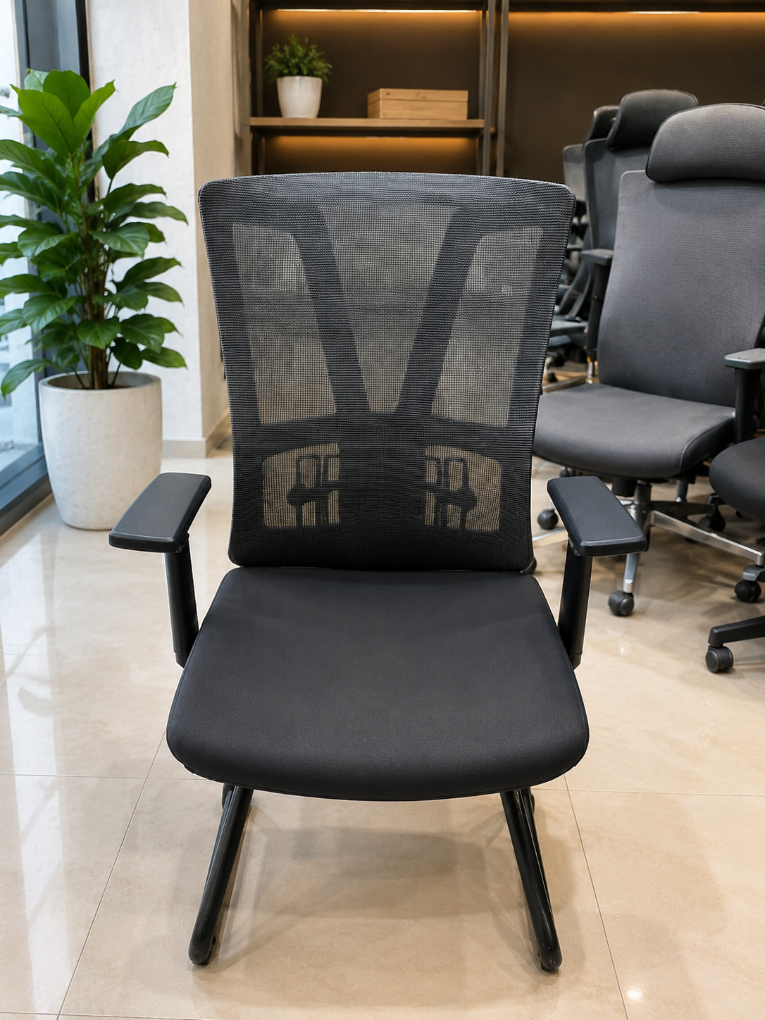 Black ergonomic mesh office chair with sled base and padded armrests