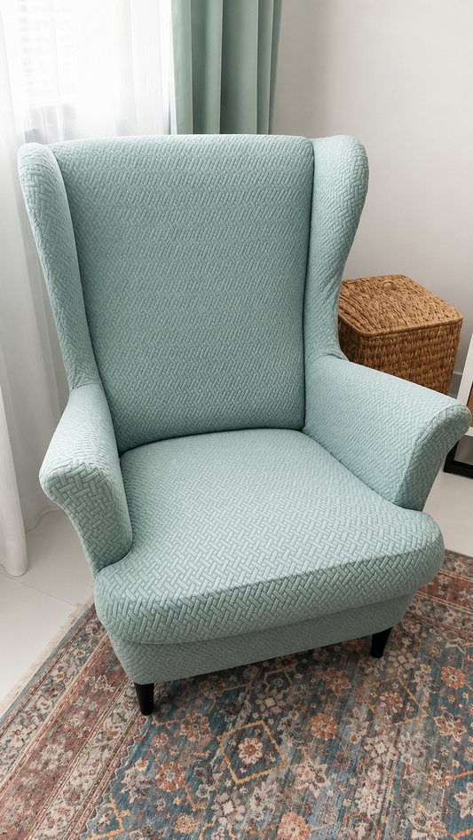 Pre-loved teal wingback armchair
