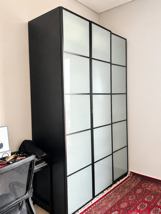 Large black wardrobe with sliding frosted glass doors - exterior view