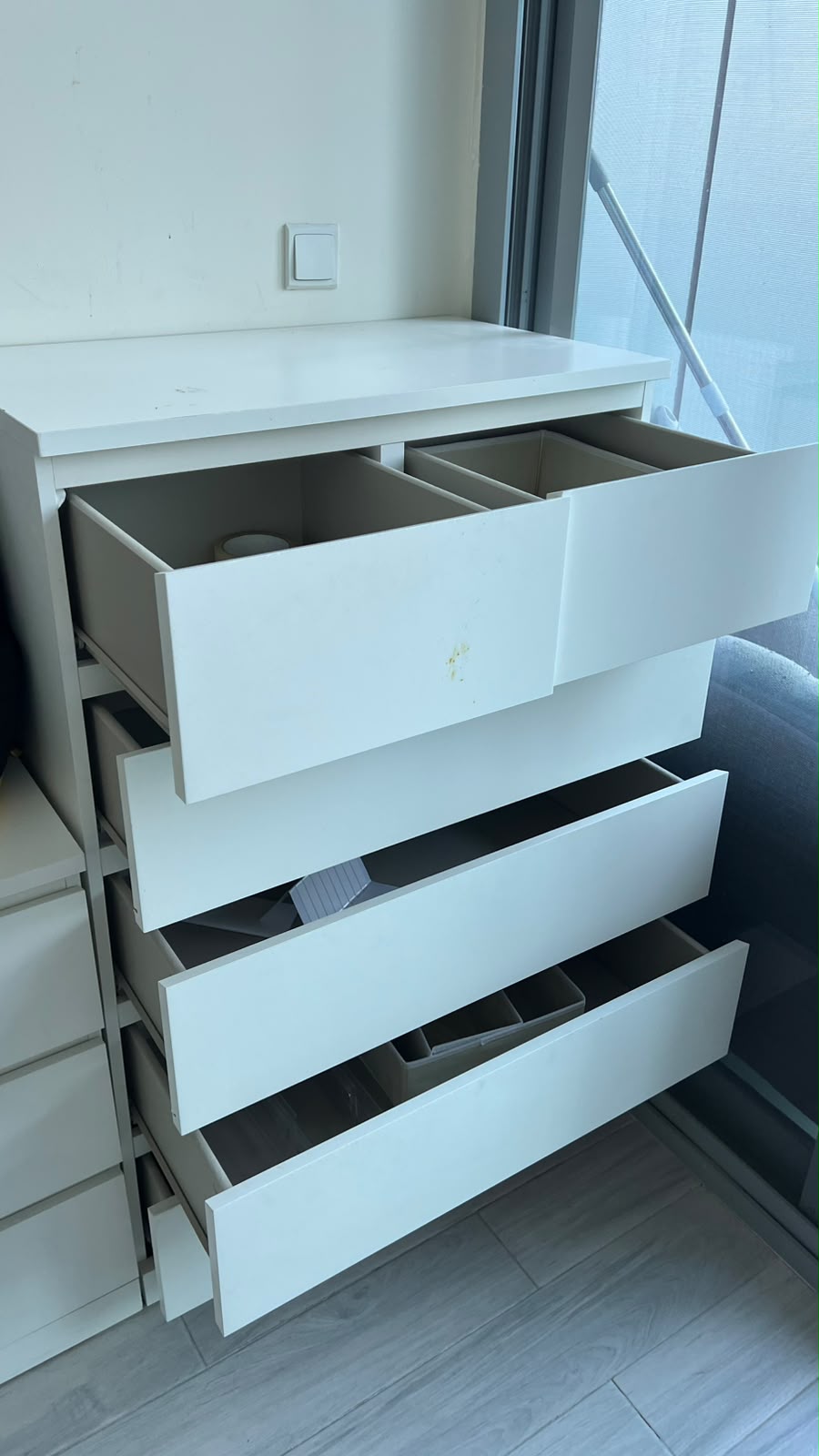 White 4-drawer chest of drawers with open drawers