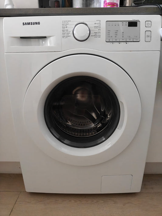 Samsung front-load washing machine in white