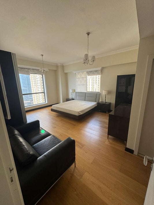 Complete bedroom set with upholstered bed, nightstands, dark wood dresser and black leather sofa