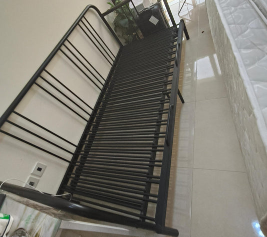 Black metal single bed frame with slatted base
