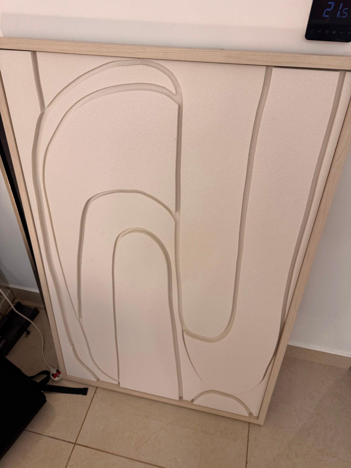 Abstract arch cabinet in cream and beige tones