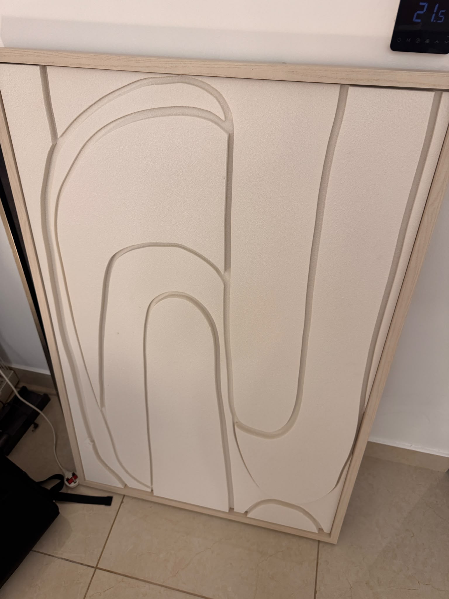 Abstract arch cabinet in cream and beige tones