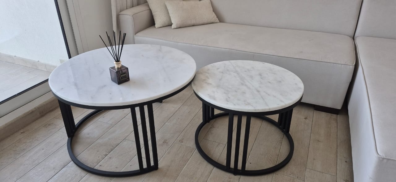 Set of 2 nesting coffee tables with white marble tops and black metal bases