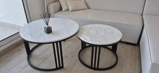 Set of 2 nesting coffee tables with white marble tops and black metal bases