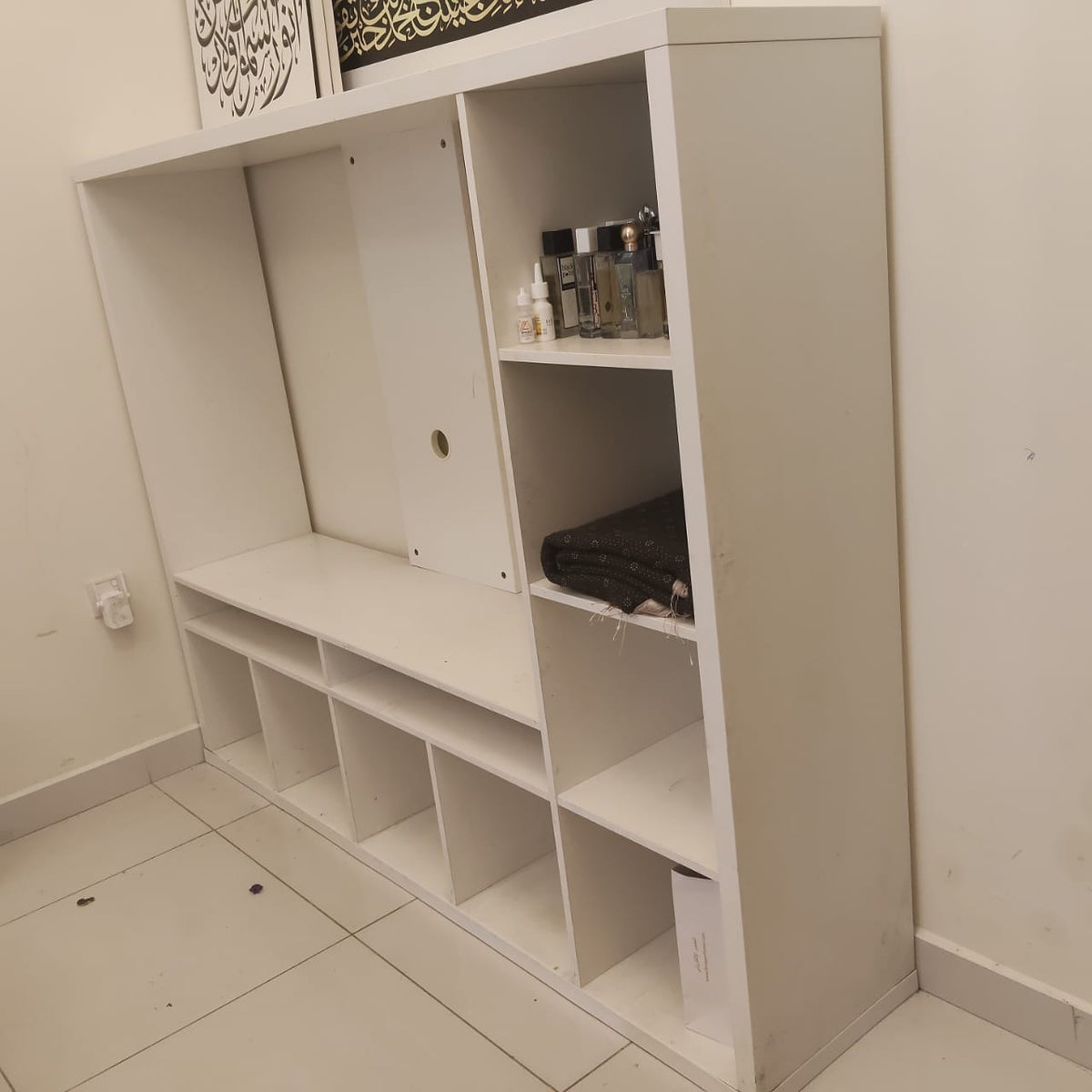 White multi-compartment shelving and media unit