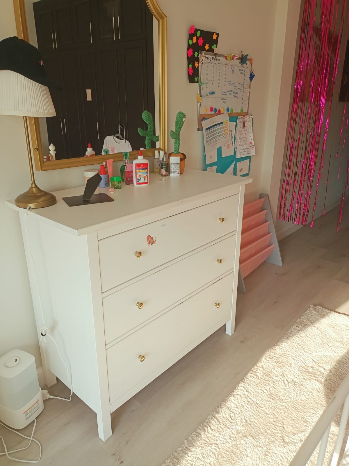 Original photo of white three-drawer dresser in bedroom