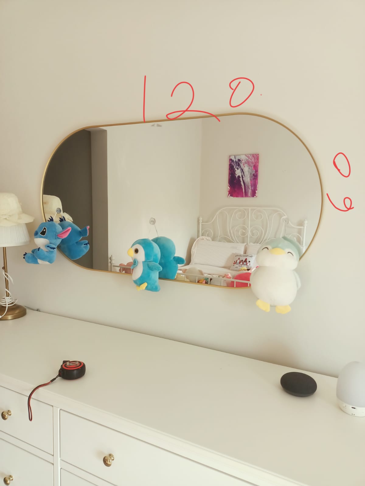 Original photo of wide rounded mirror above dresser with handwritten markings