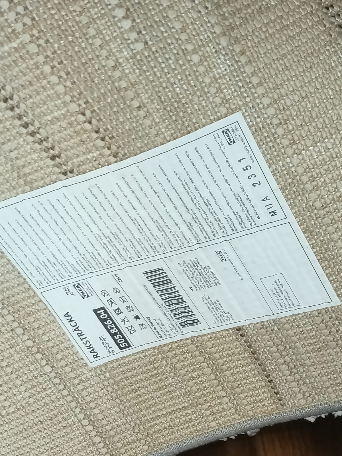 Close-up of label on underside of area rug