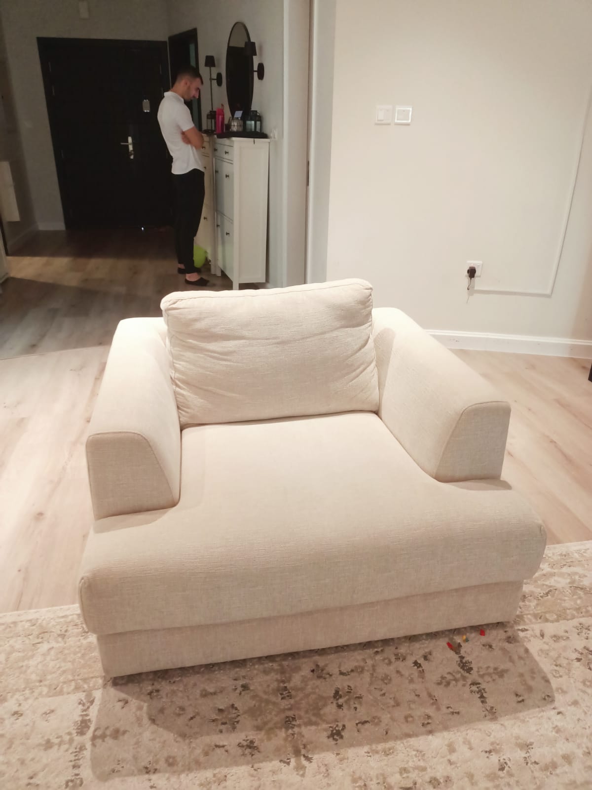 Original photo of wide cream lounge chair in living room