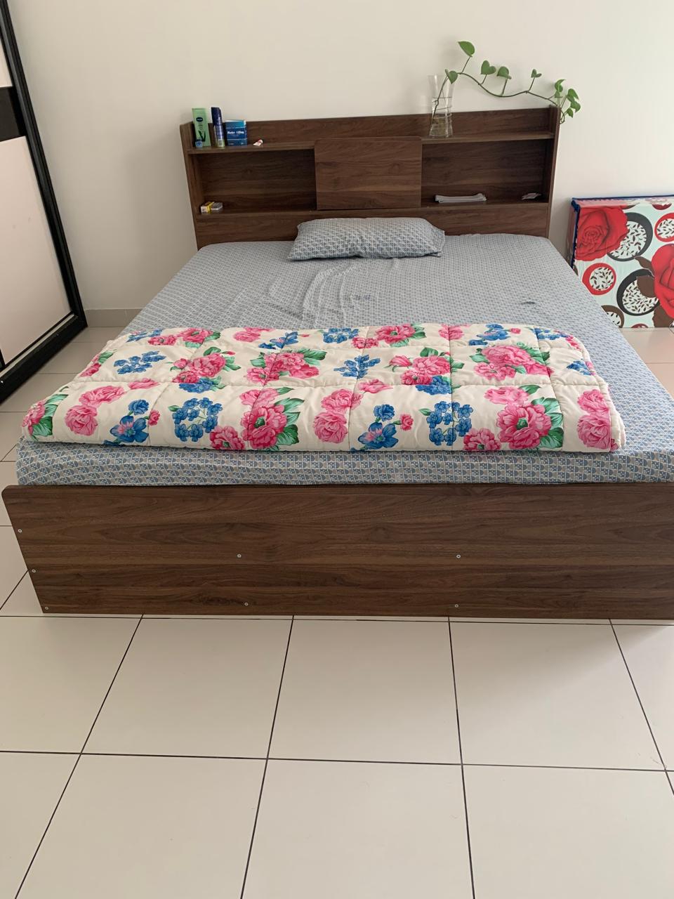 Brown wood-look bed frame with open shelves in the headboard and a matching panel footboard