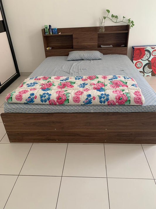 Brown wood-look bed frame with open shelves in the headboard and a matching panel footboard