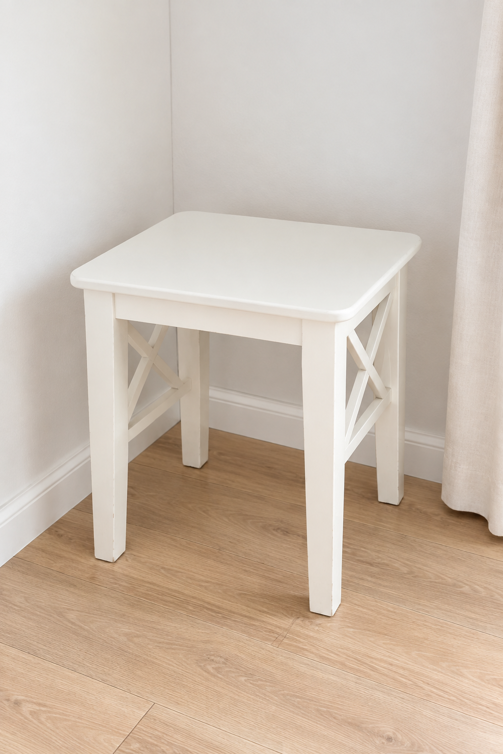 Edited photo of white square side table with X-brace details