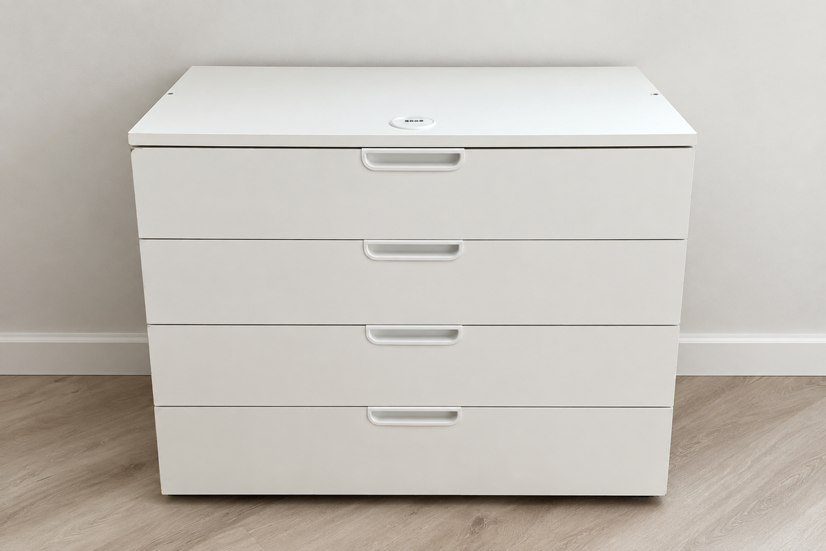 Edited photo of low white chest with four wide drawers and recessed handles