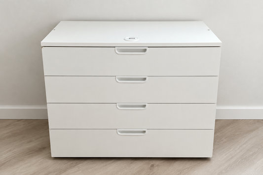Edited photo of low white chest with four wide drawers and recessed handles